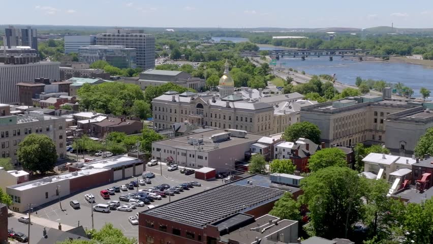 New Jersey state capitol building in Trenton, New Jersey with drone video moving in a wide circle parallax.