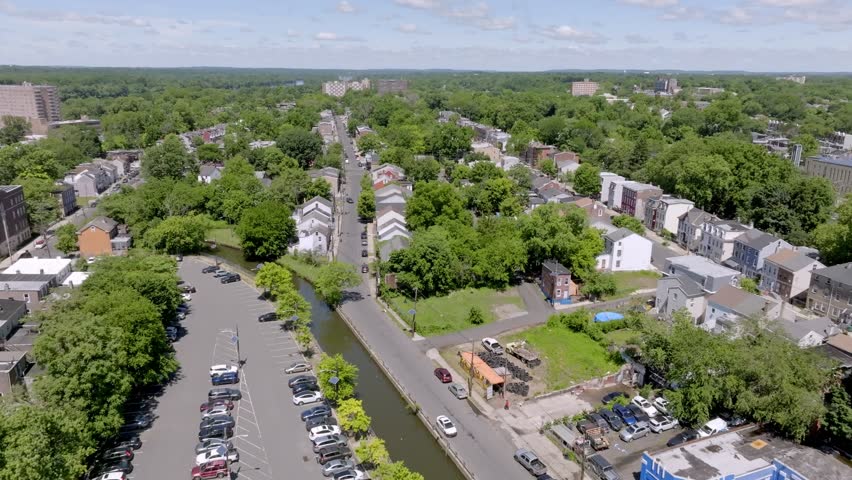 Neighborhood homes in Trenton, New Jersey with drone video moving forward.