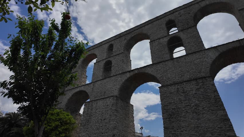 Kavala, Eastern Macedonia and Thrace, Greece - May 21st, 2026 - street footage of the historical town in Northern Greece, square, aqueduct, streets, hotels, Byzantine castle, parks, architecture, facades, embankment, Aegean sea coastline in late spring