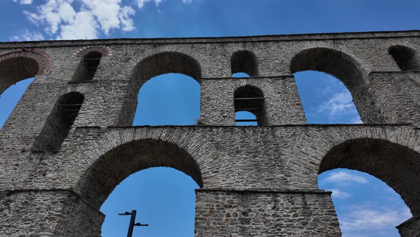 Kavala, Eastern Macedonia and Thrace, Greece - May 21st, 2026 - street footage of the historical town in Northern Greece, square, aqueduct, streets, hotels, Byzantine castle, parks, architecture, facades, embankment, Aegean sea coastline in late spring