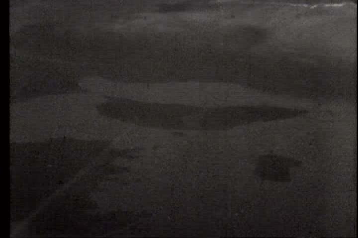 1940s - A film about World War II - footage of planes flying and bombing the German warship, Tirpitz