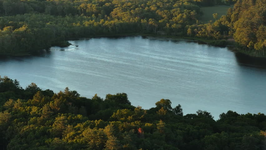 Drone footage of a lake in Connecticut. Shot at sunset.