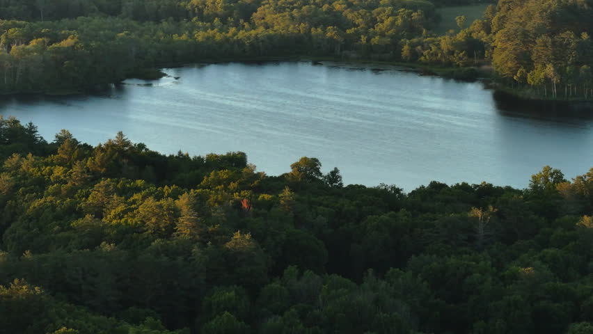 Establishing shot of a lake in rural Connecticut. Shot on a summer day in New England.