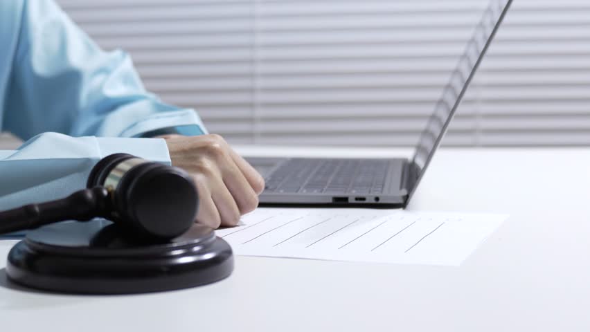 Auction gavel laptop office desk hand document contract sale judge courtroom legal hearing lawyer justice law contract office desk hand document gavel laptop auction sale judge legal law justice