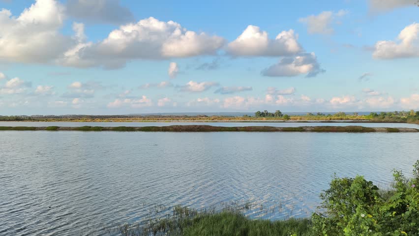 Salt Pond Landscape View under Blue Sky and White Clouds at Daytime