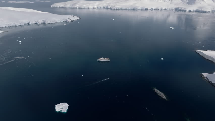 Expedition ship among floating ice in Antarctica