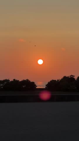 Vertical orange sunset over the sea