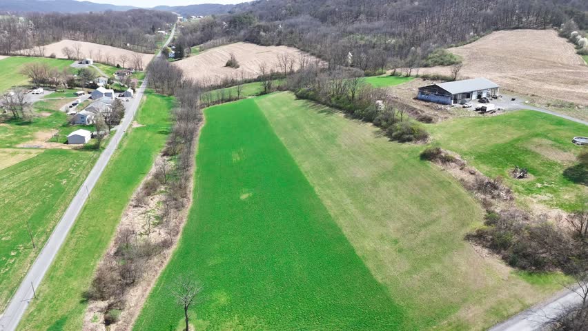 Aerial view of farmland and rural road through fields near Herndon Pennsylvania