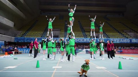 MOSCOW - MAR 24: Performance of cheerleaders Dream Team at Championship and Contests of Moscow in cheerleading at Palace of Sports Dynamo, March 24, 2012, Moscow, Russia.