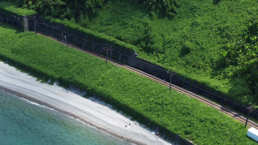 Coastal railroad and concrete tunnel at Batumi Botanical Garden in Georgia

