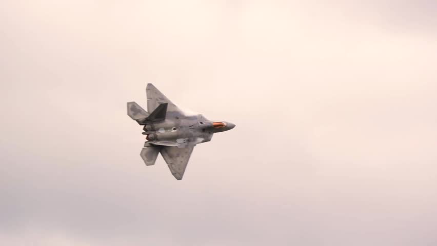 F-22 Raptor Stealth Fighter Performing High-Speed Flight Demonstrating Advanced Air Superiority and Stealth Capabilities.