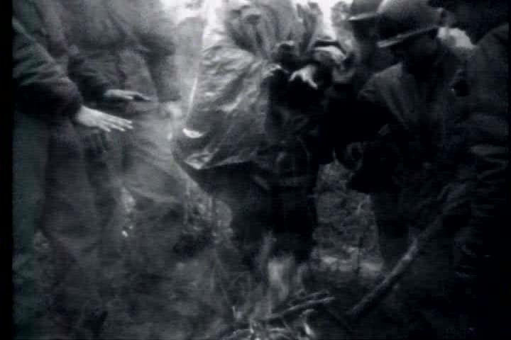 1950s - A film about the Korean War - footage of troops communicating and firing artillery