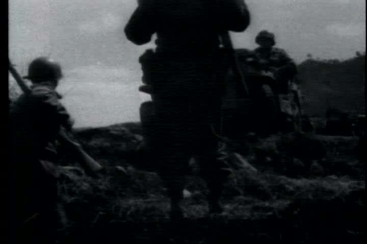 1950s - A film about the Korean War - footage of a tank convoy