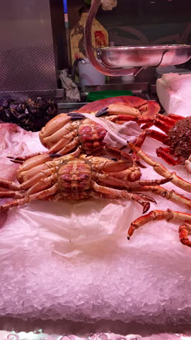 Diverse selection of fresh foods and regional specialties fills the bustling Central Market creating an authentic shopping experience in Valencia, Spain