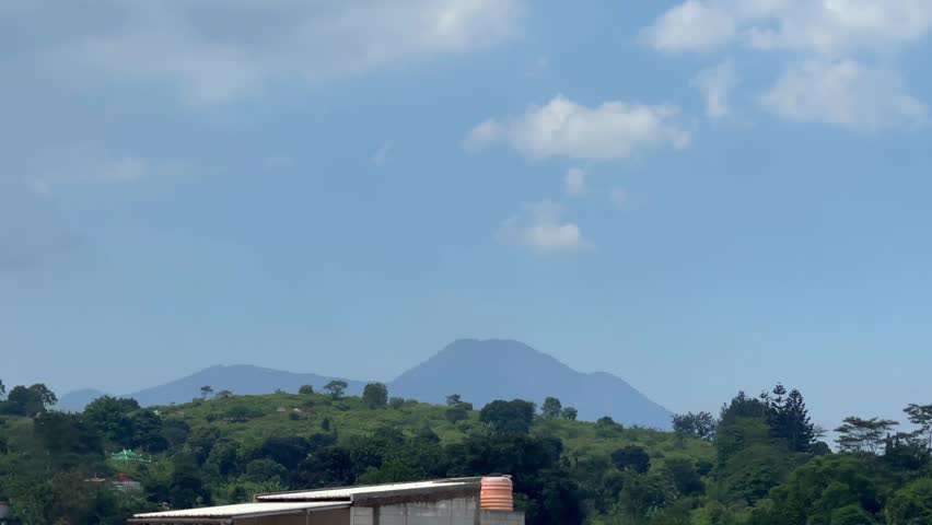 Scenic mountain landscape view under blue sky with clouds