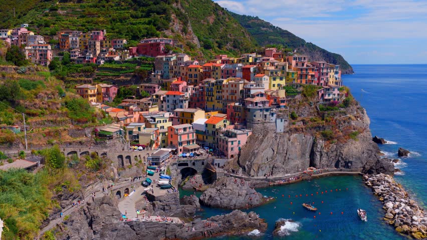 Daytime drone shot of Manarola village in Cinque Terre in Italy, Liguria, Italian Riviera aerial view, holiday in Italy