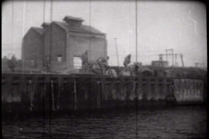 1950s - A film about the Korean War - footage of American troops destroying a Korean city so that the Chinese and North Koreans cannot use it