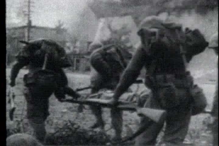 1950s - A film about the Korean War - footage of a street battle in Seoul, South Korea