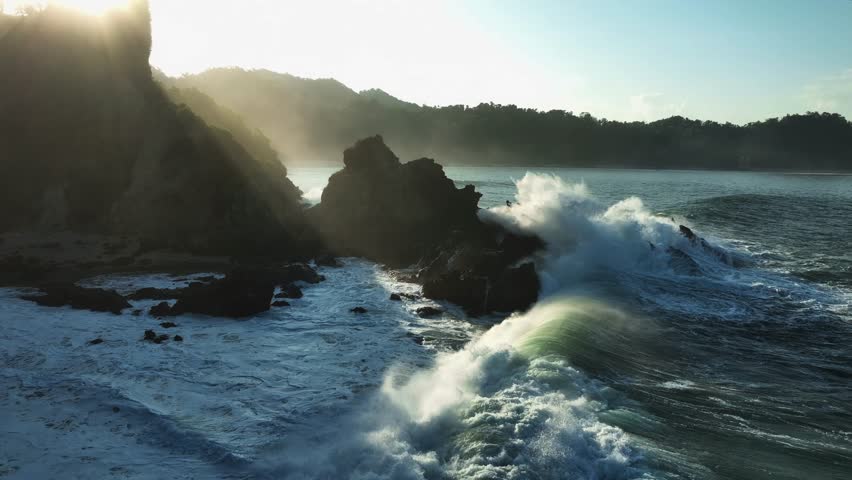 Sunset Light Over Coastal Cliffs and Ocean Waves