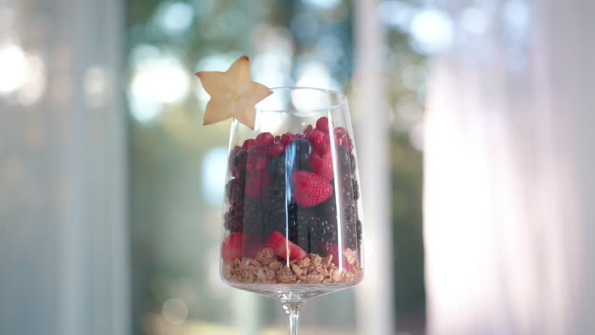 Organic Fruit Mix with Fruits and Berries. Fresh Summer Mix Fruits for Healthy Lifestyle and Detox. Mix Fruits Composition. Delicious Fruit Mix on Kitchen Table near Window. Balanced Fruits Diet.