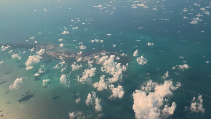 Tropical Overview: 4K Aerial Window View Flying Over the Florida Keys from a Commercial Airplane