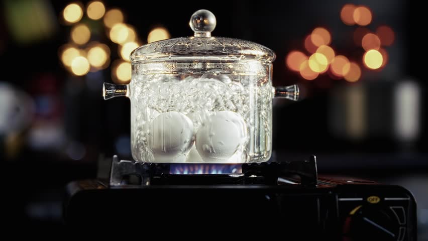 Boiling Eggs In Pot. Cooking Process Breakfast Preparation.  Food And Nutrition Kitchen Cooking. Healthy Eating Protein Source. Meal Preparation Water Bubbling Hard-Boiled Eggs Cooking