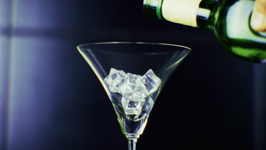 Vermouth Aperitif Poured Into Glass. Bitter Alcohol Spritz. Refreshing Aperitive Drink.Dry Martini Cocktails With Ice Cube.Aperitif Martini Glasses. Bartender Mixing Aperitif Alcohol Vermouth Ice Cube