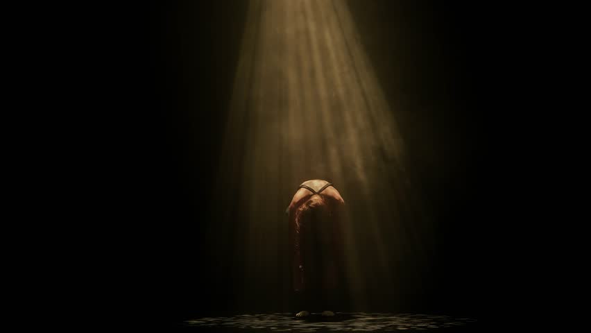 A woman dances with outstretched arms under golden stage light on a dark smoky floor. Concepts related to dance, self discovery, album covers, singles, or podcasts