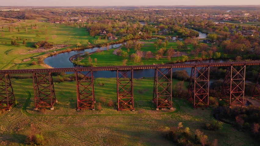 Train tracks receding to a vanishing point above the Sheyenne River and the small town of Valley City, North Dakota. Hi-Line Railroad Bridge