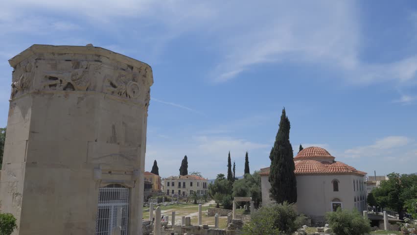Historical Horologion of Andronikos Cyrrhestes and Fethiye Mosque Museum in Athens, Greece, captured on a clear day.