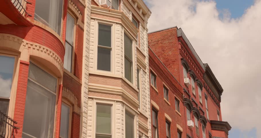Close-up building facade view of historic Galena architecture featuring arched bay windows and decorative details, Galena, Illinois, USA