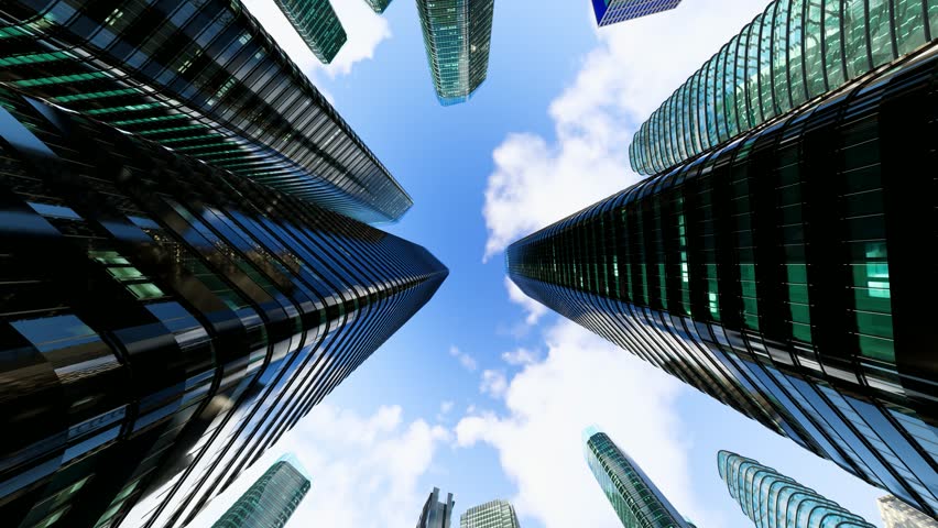 Time-lapse of modern city skyscrapers against a blue sky with white clouds