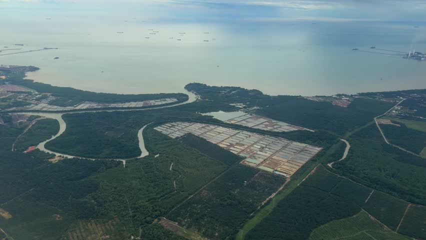 Airplane window view landing at Kuala Lumpur International Airport KUL Malaysia Southeast Asia