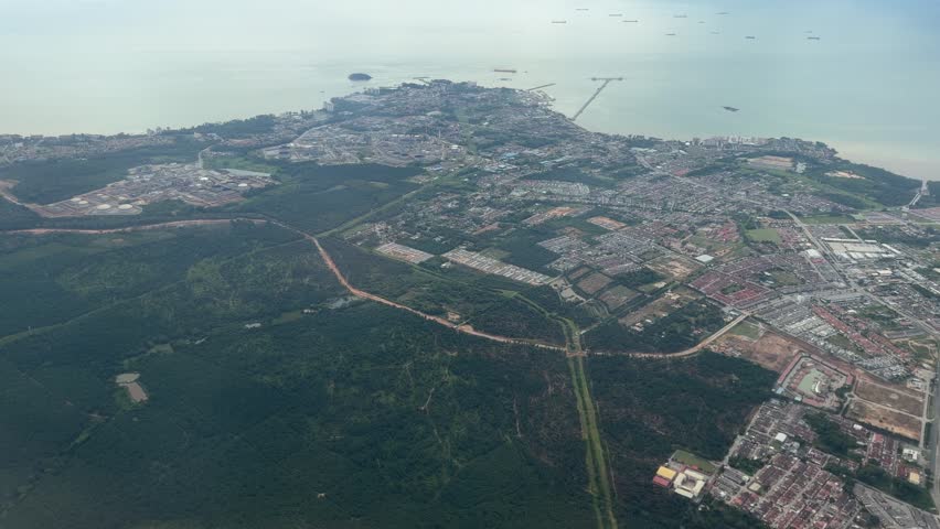 Airplane window view landing at Kuala Lumpur International Airport KUL Malaysia Southeast Asia