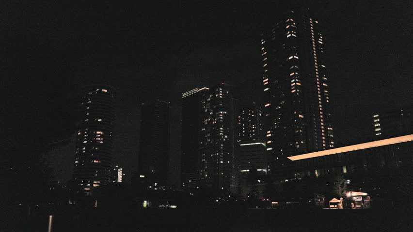 Night in Tokyo  :  View of Skyscrapers Rising From the Darkness at a Park Plaza  |  Ikebukuro, Tokyo, Japan