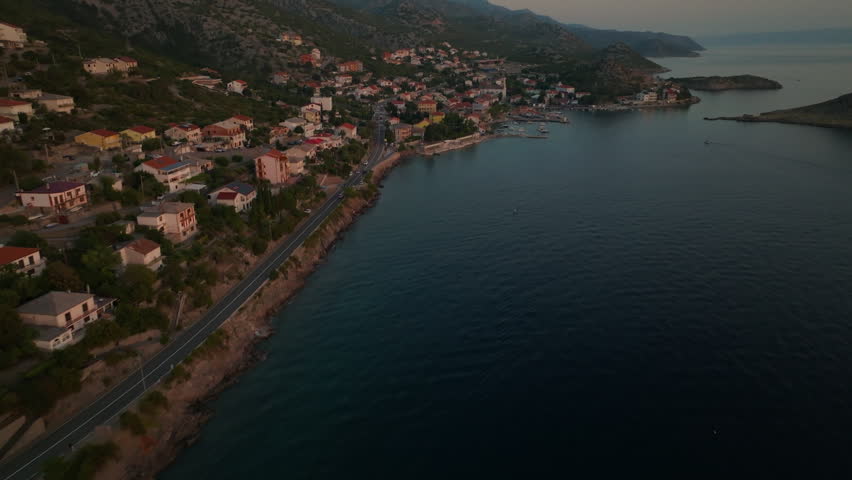 Drone shot of sunset over Adriatic sea and Sveti Juraj harbor in Croatia