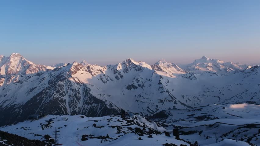 Sunrise on Mount Elbrus, view of mountains from the slope of Mount Elbrus, Russia