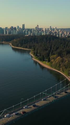 Aerial view of Lions Gate Bridge and Stanley Park at dawn. Canada