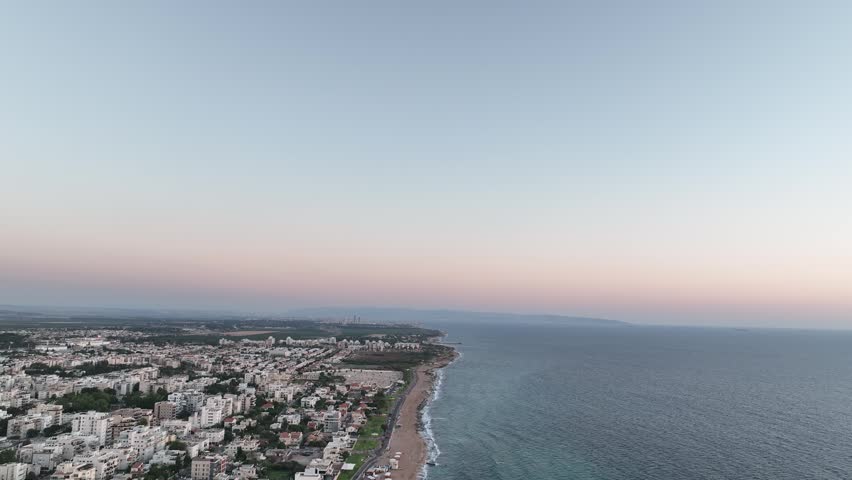 Aerial view of the coastline stretching from Nahariya towards Acre and Haifa at sunset