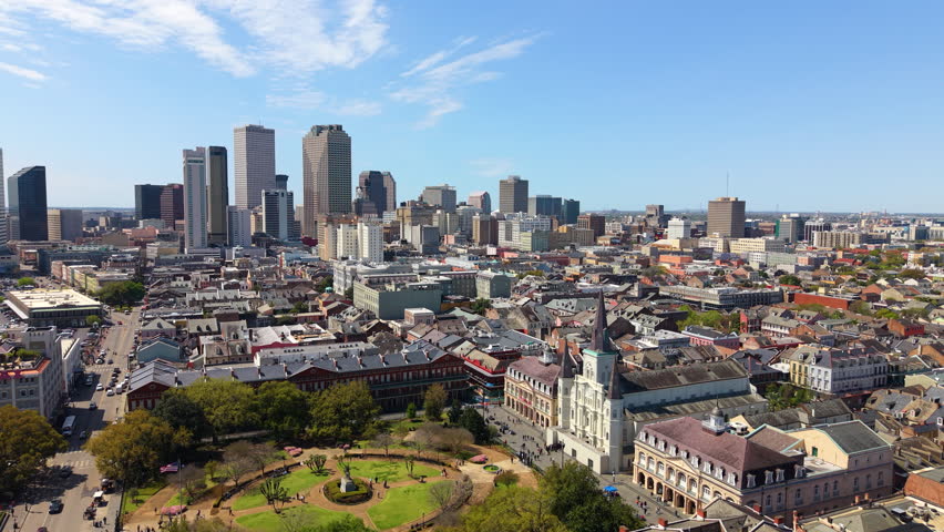 Aerial cityscape of Jackson Square in New Orleans, Louisiana with St. Louis Cathedral, modern buildings and urban neighborhoods. One of the most recognizable skylines in American South.