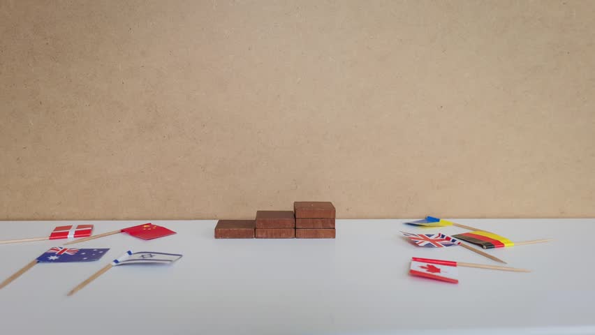 A Belgian Flag Rises Above Global Rivals on Stacked Wooden Victory Steps