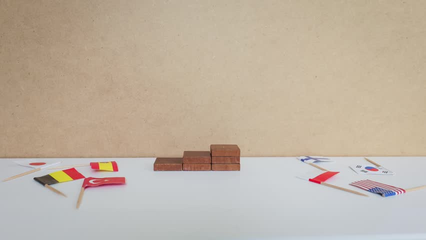 A German Flag Rises Above Global Rivals on Stacked Wooden Victory Steps