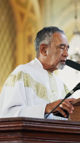 Altar, praying and pastor in church for sermon, blessing or gospel for worship in cathedral. Man, chapel and senior spiritual leader with preach scripture on podium for religion in holy building.