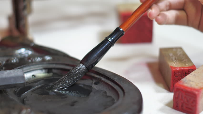 Writing Spring Festival couplets and giving red envelopes。“福”means blessing.”吉祥如意“means Good luck and good luck.