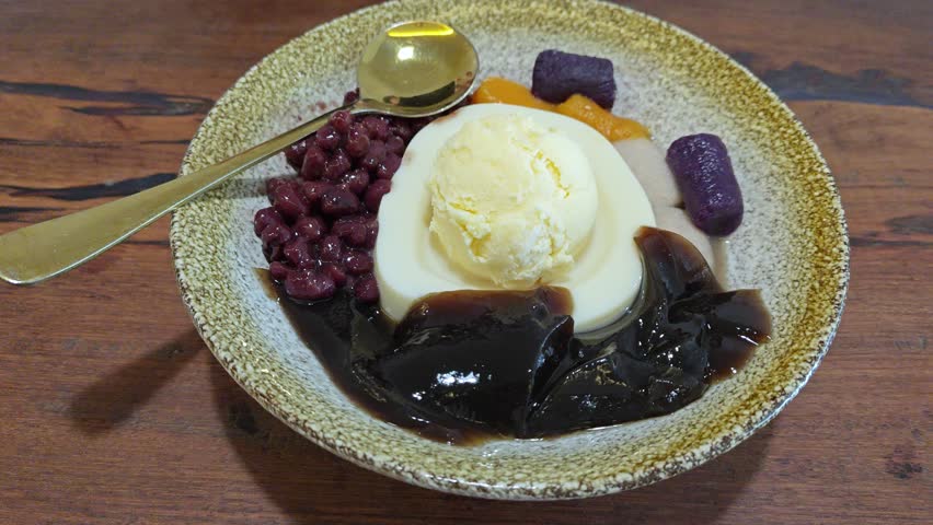 A plate of black jelly, red bean and pudding ice cream.