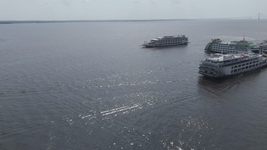 Amazonian Passenger ferry sailing through Manaus Harbour, Brazil, showing maritime travel and river shipping activities, cinematic aerial view
