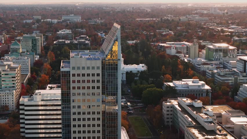 Drone view cityscape autumn trees Sacramento California State Capitol building.