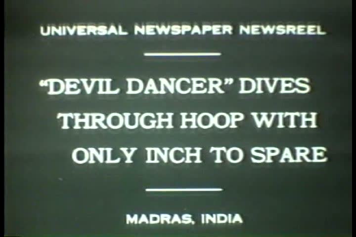 1930s - Black and white footage of people dancing and jumping through hoops in the 1930s. slow motion. 