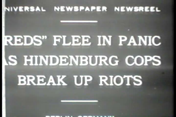 1920s - Black and white footage of police breaking up a communist rally in the 1920s