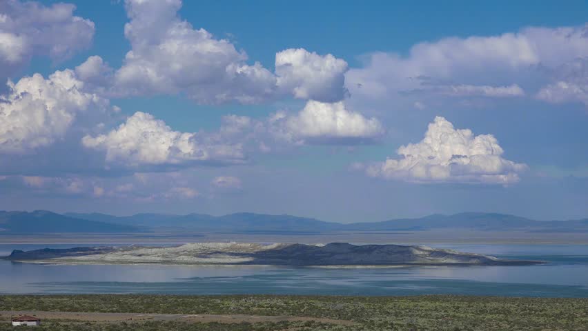 Aerial landscape view showing island surrounded by water.